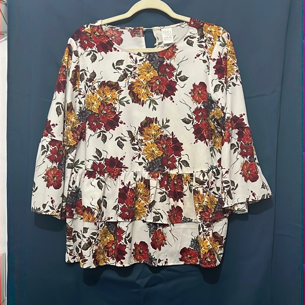 Red,yellow and blue floral print with ruffles.